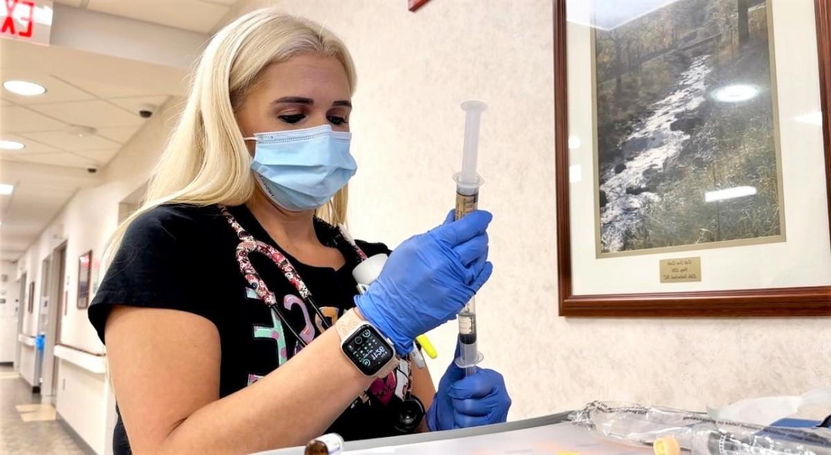 Lisa Fleming, RN, prepares medication for a patient on 4th Surgical.